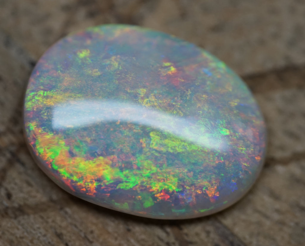 Bright Golden Oval with Red Hues - 5.4 Carats. 0010