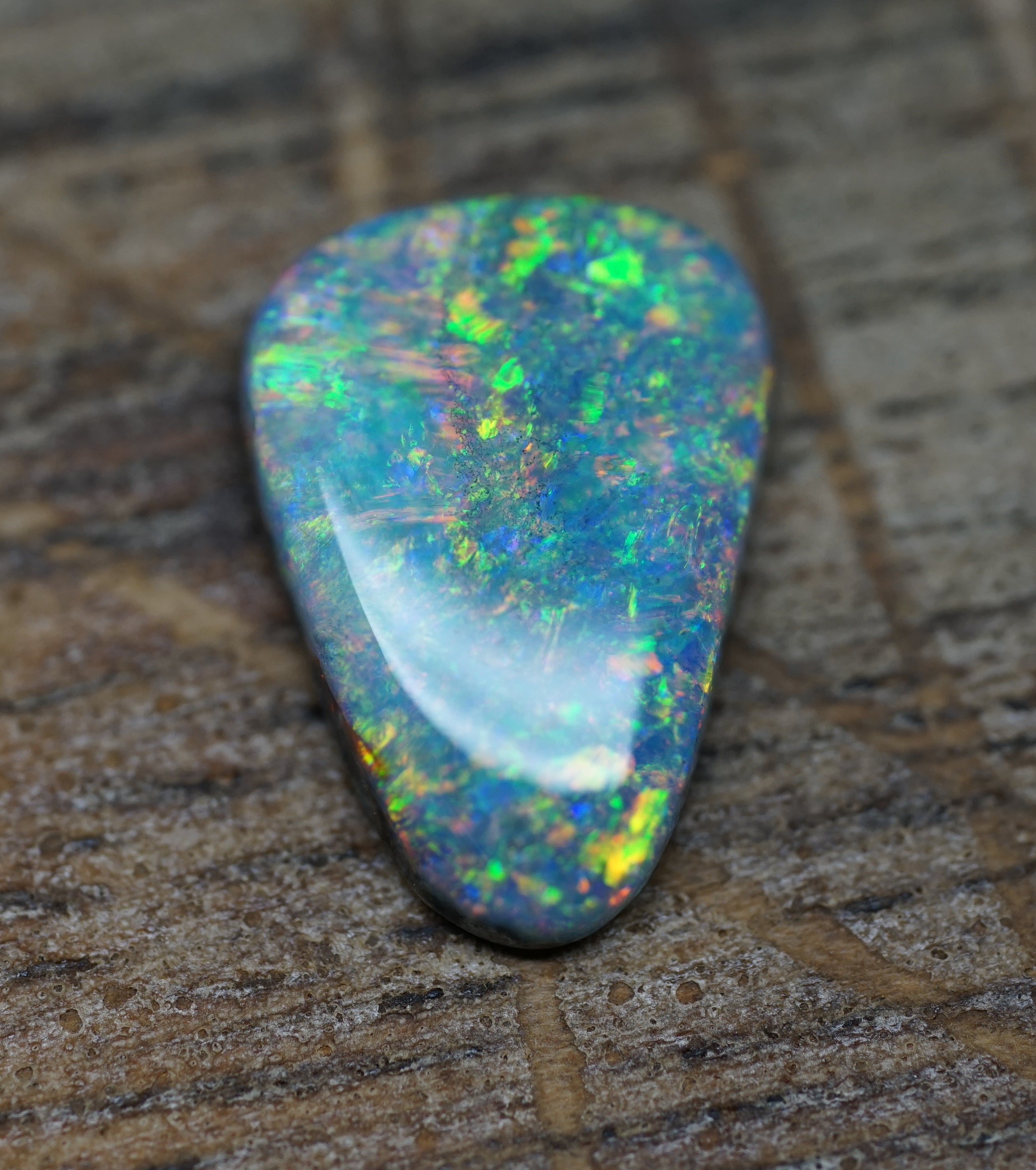 Coober Pedy Triangular Cut Black Opal - 1.6 Carats. 0028