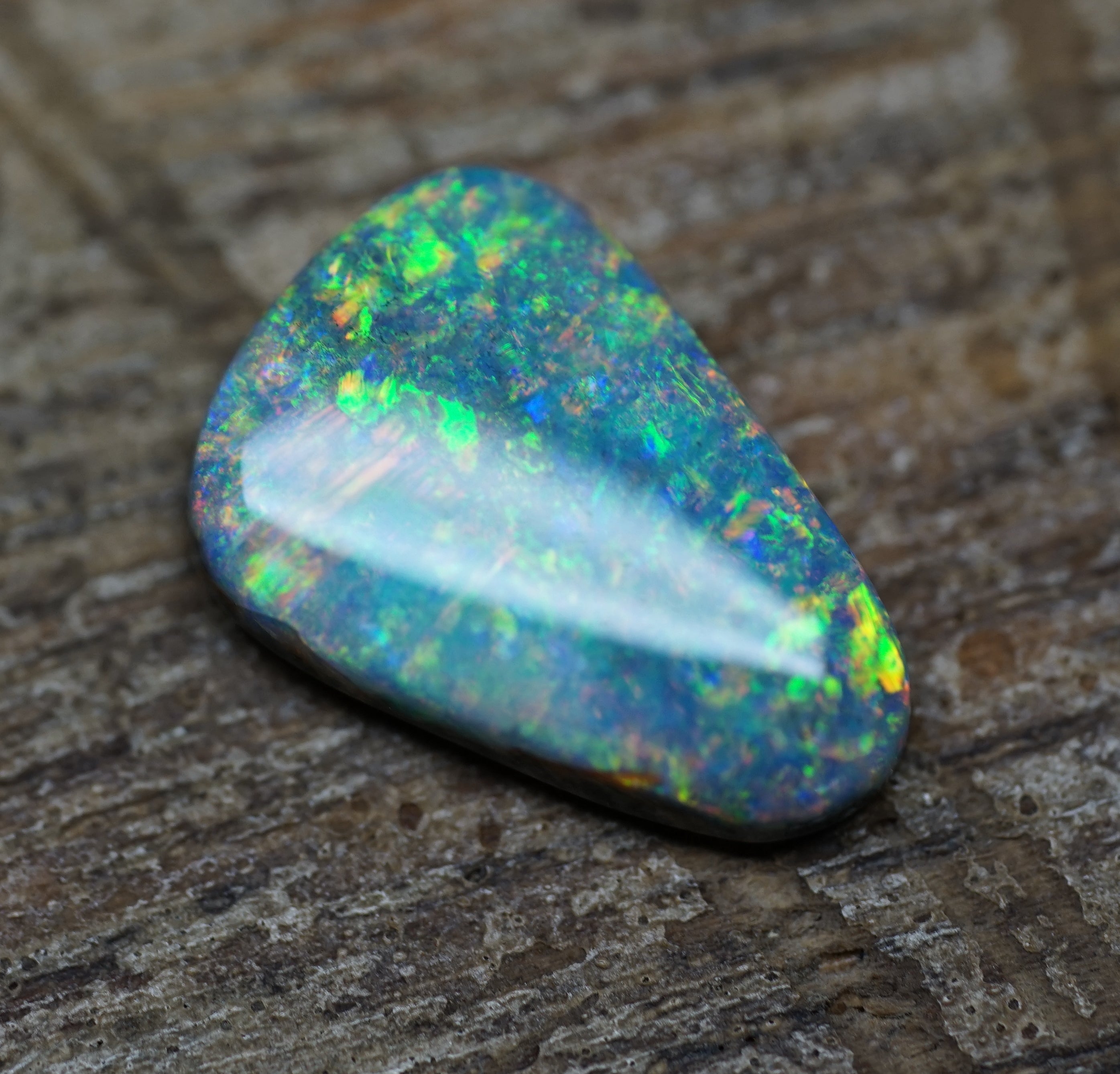 Coober Pedy Triangular Cut Black Opal - 1.6 Carats. 0028