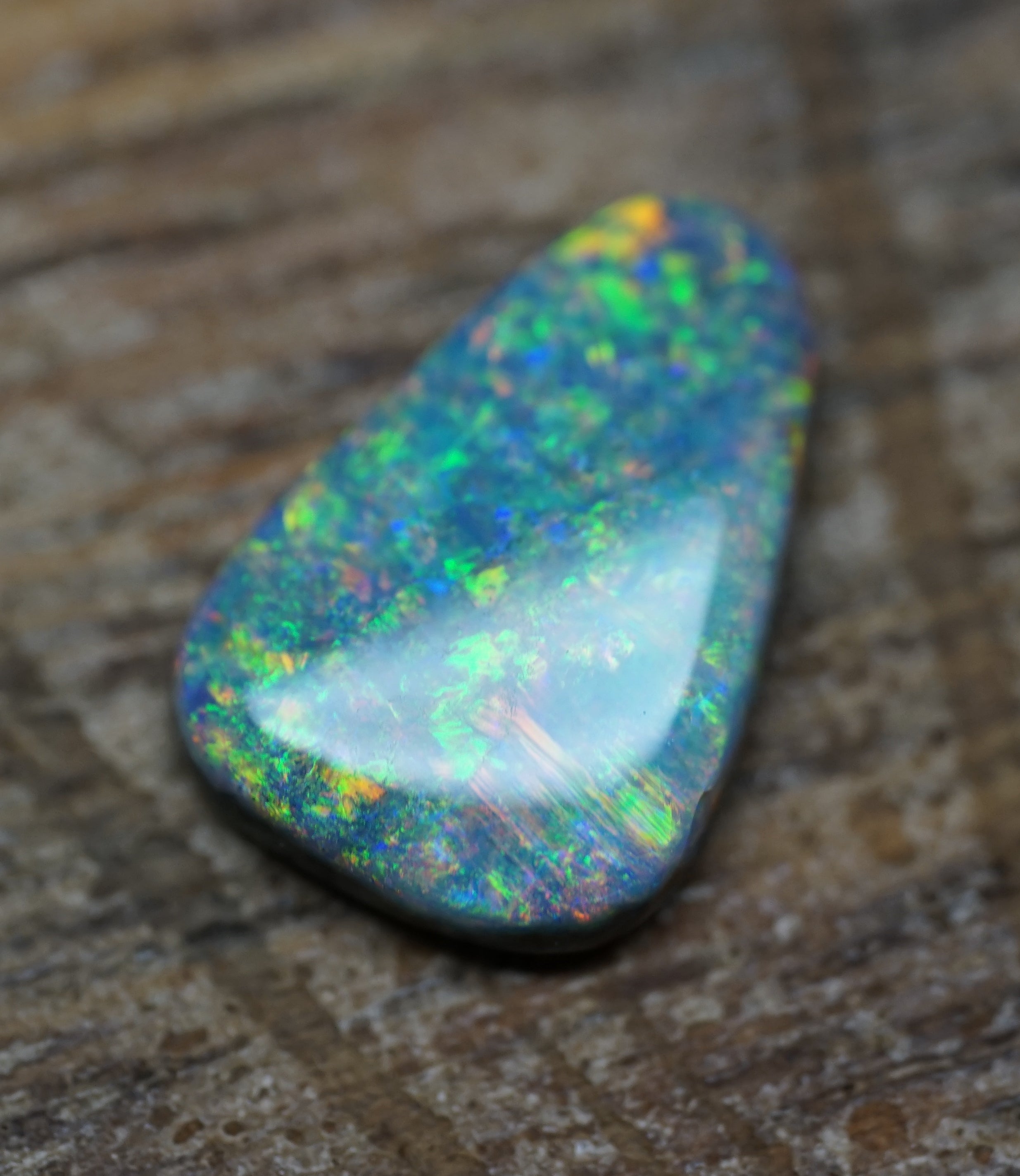 Coober Pedy Triangular Cut Black Opal - 1.6 Carats. 0028