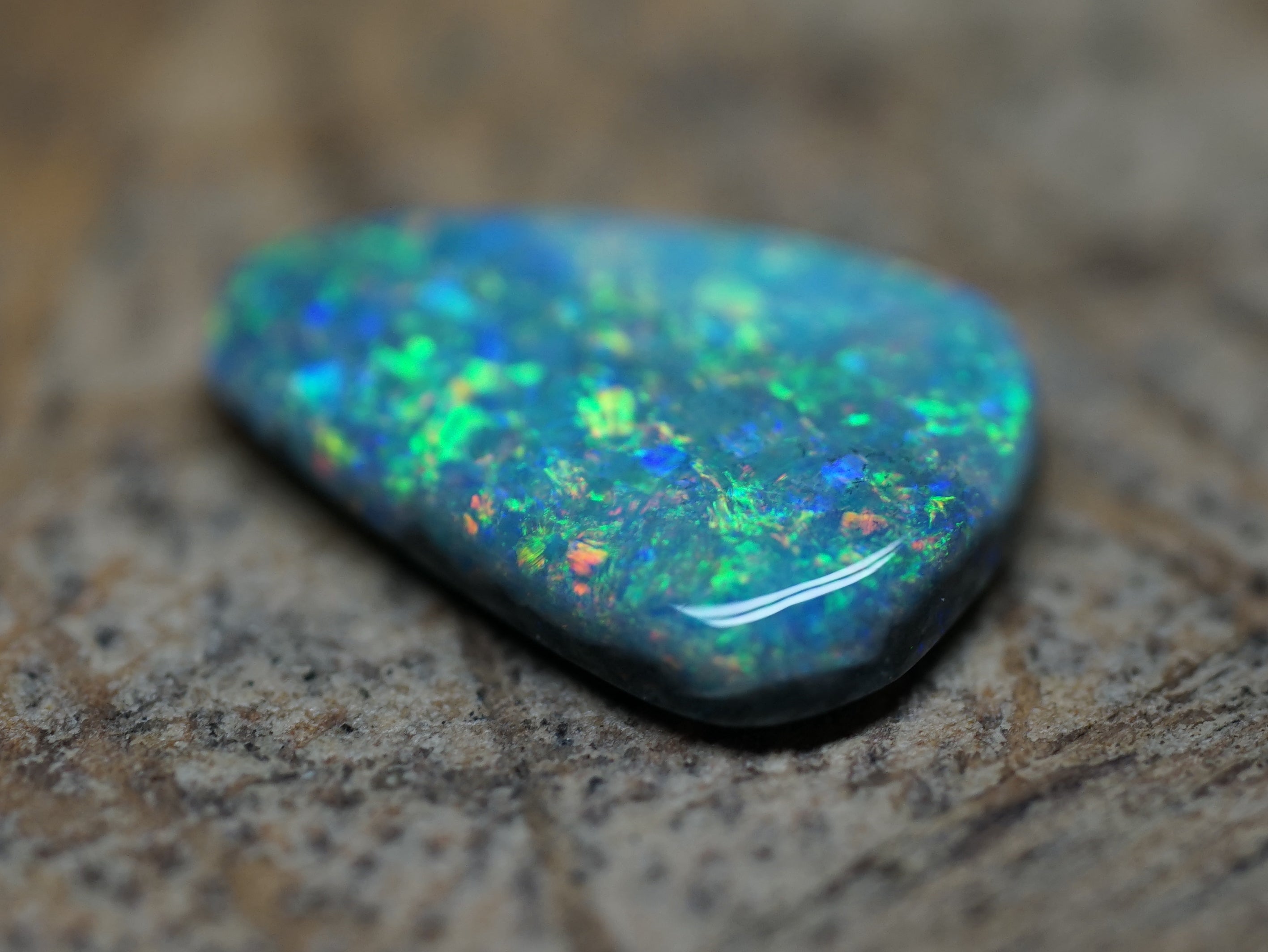 Coober Pedy Triangular Cut Black Opal - 1.6 Carats. 0028